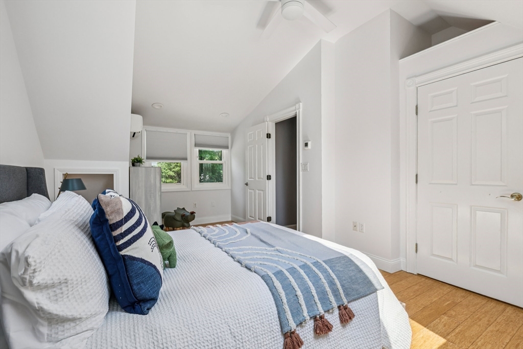 19 Cross Road Boxford, MA 01921 - Photo 5 of 41 a bedroom with a bed and a chandelier