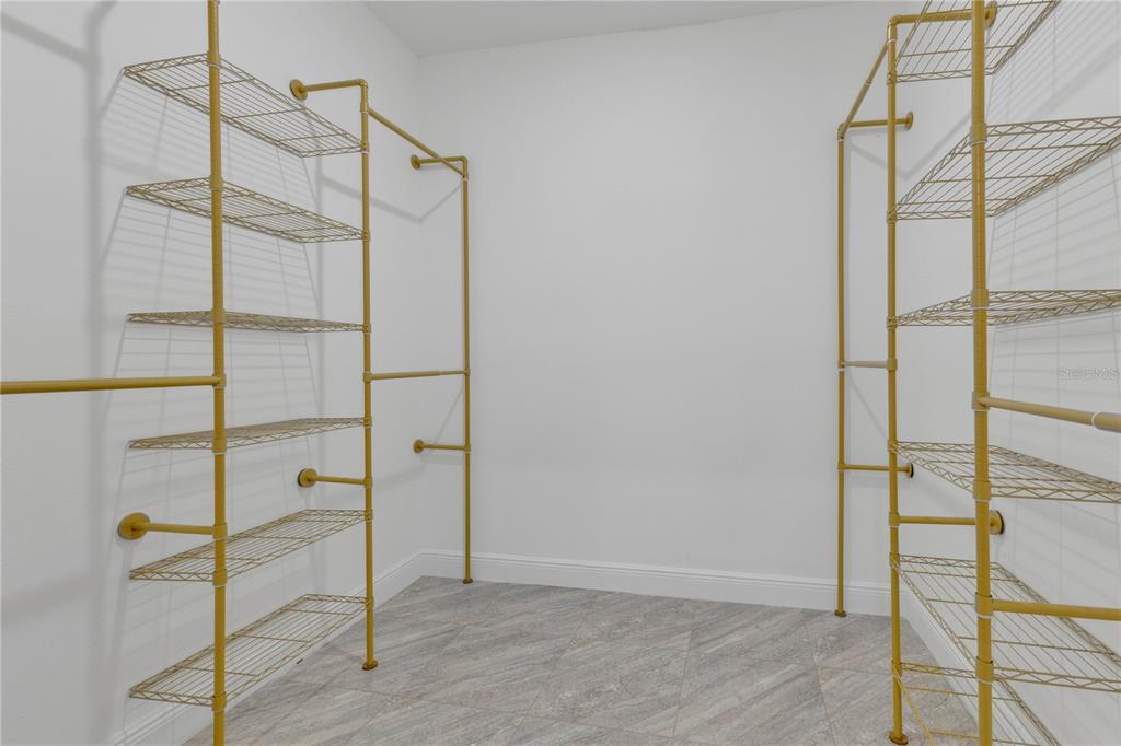 1425 River Road St. Cloud, FL 34769 - Photo 14 of 32 a bathroom that has a glass shower door