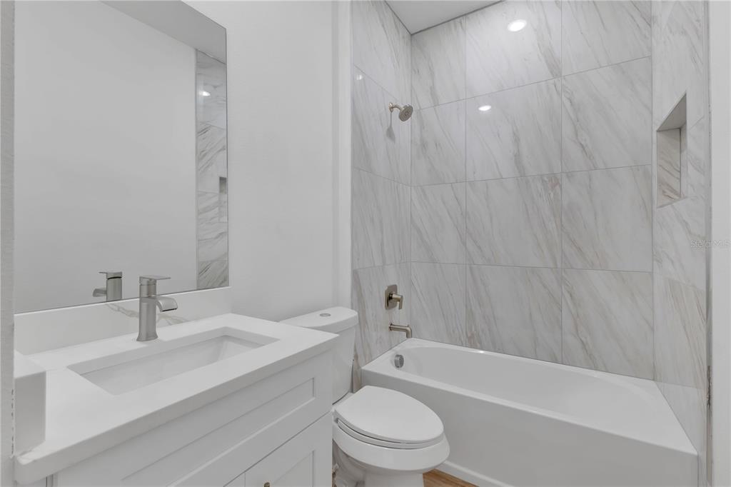 1425 River Road St. Cloud, FL 34769 - Photo 16 of 32 a bathroom with a sink toilet and shower