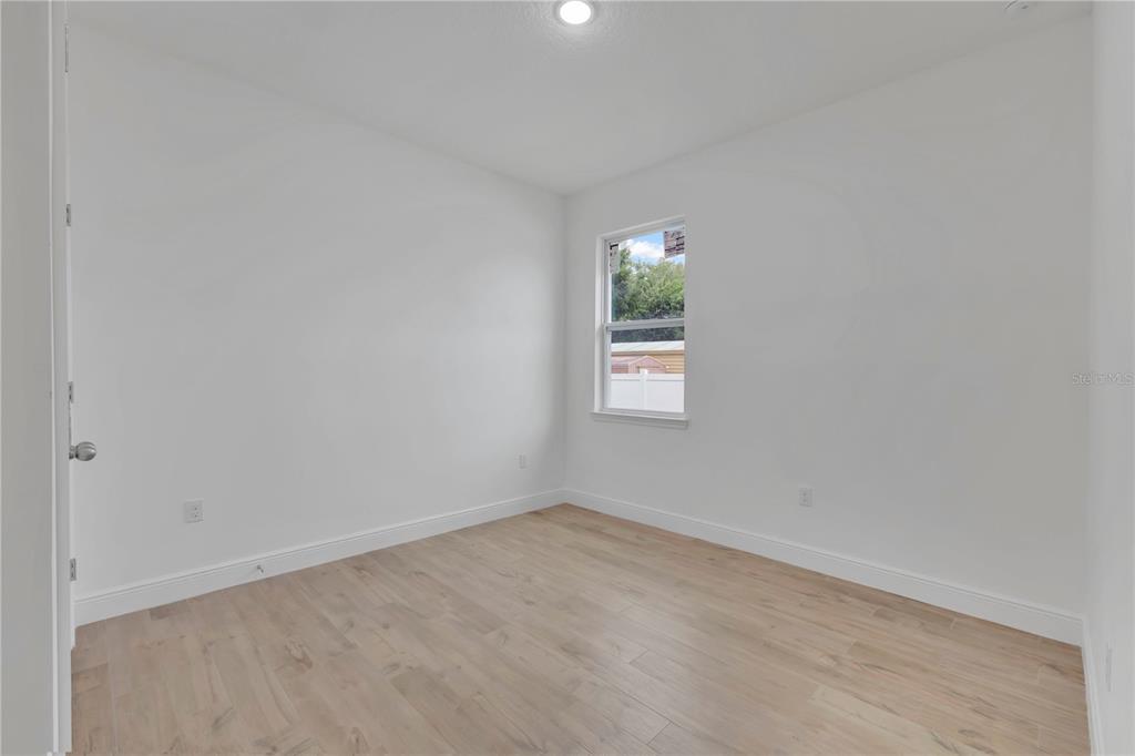 1425 River Road St. Cloud, FL 34769 - Photo 18 of 32 an empty room with windows