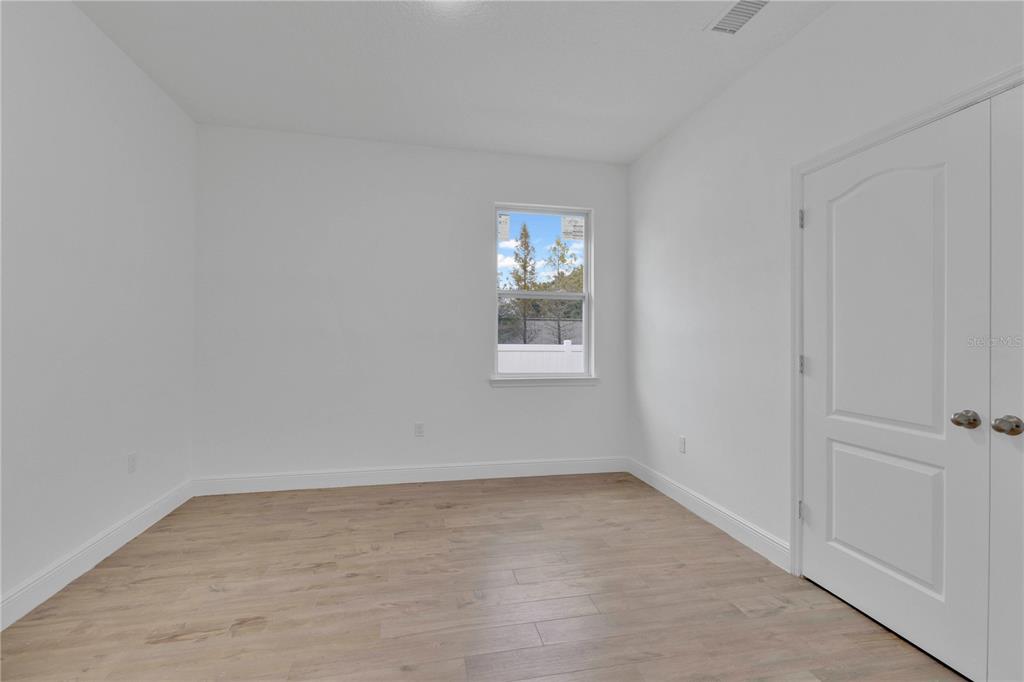 1425 River Road St. Cloud, FL 34769 - Photo 19 of 32 an empty room with windows