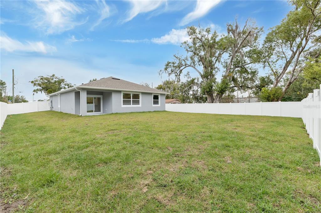 1425 River Road St. Cloud, FL 34769 - Photo 23 of 32 a view of a house with a yard