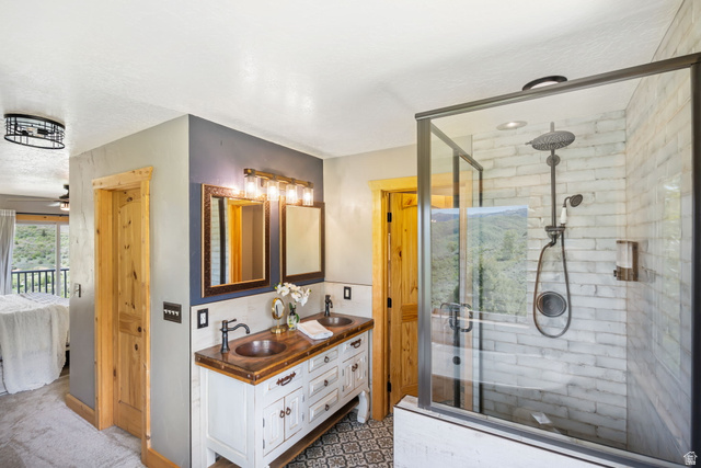 2013 North River View Road Huntsville, UT 84317 - Photo 18 of 53 Full bath featuring ensuite bath, double vanity, a shower stall, and a ceiling fan