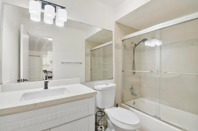 a kitchen with stainless steel appliances a refrigerator and a sink
