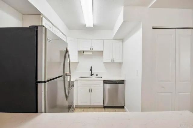 a kitchen with appliances and cabinets