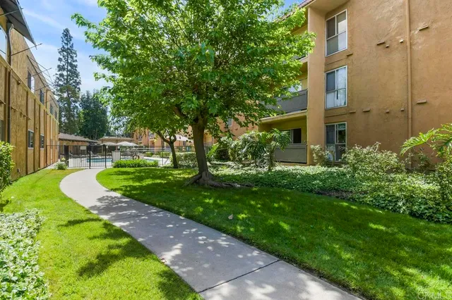 a view of a cars park in front of a building