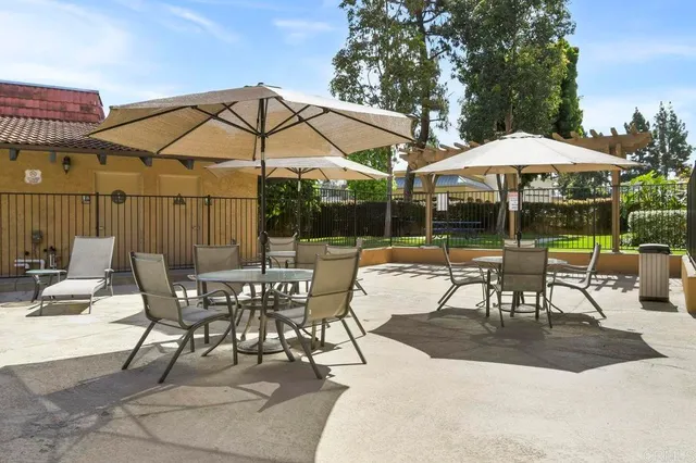 a view of swimming pool with outdoor seating