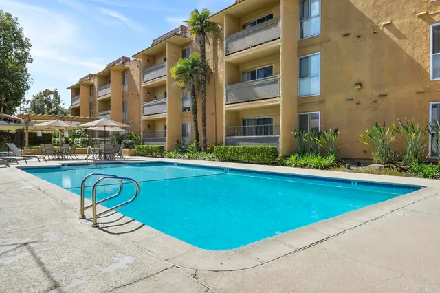 a view of a swimming pool with a lounge chairs