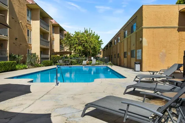 a view of a backyard with potted plants