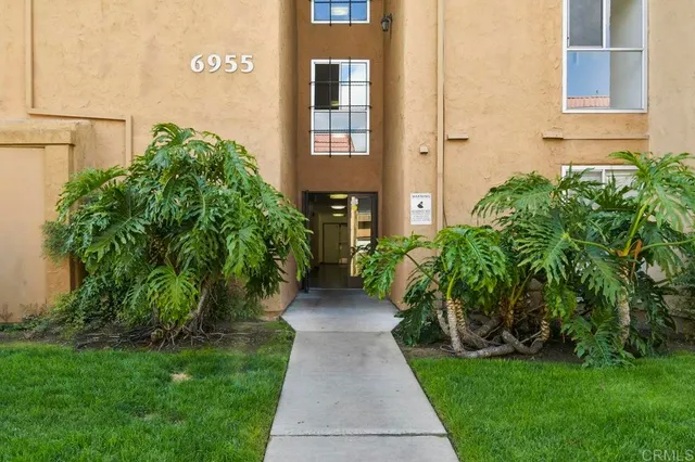a view of a livingroom with furniture and front door