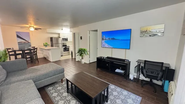 a living room with furniture and a flat screen tv