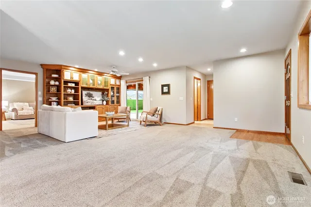 a view of a livingroom with furniture and white walls