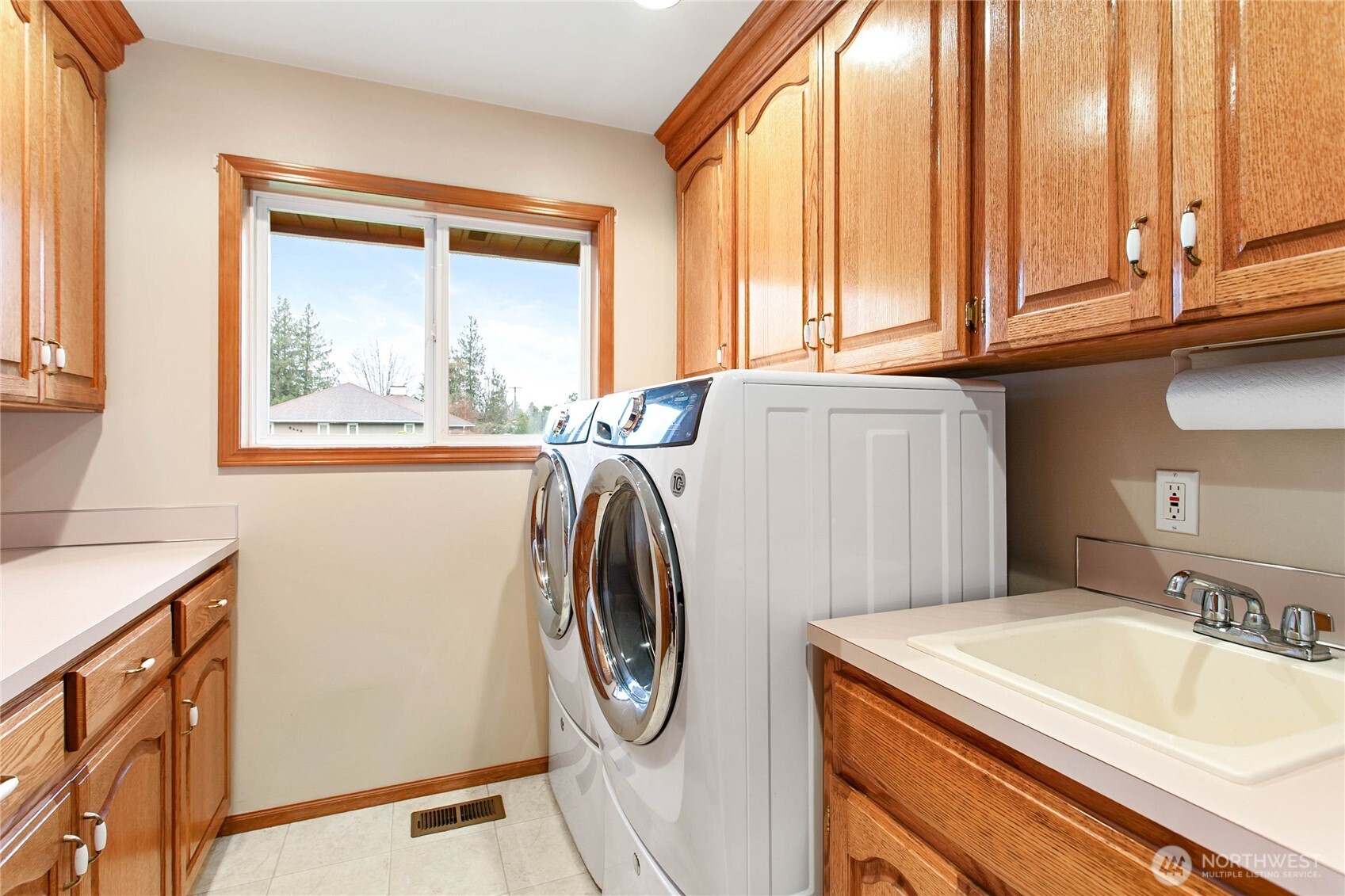 8639 Bender Road Lynden, WA 98264 - Photo 18 of 40 a utility room with a window dryer and washer