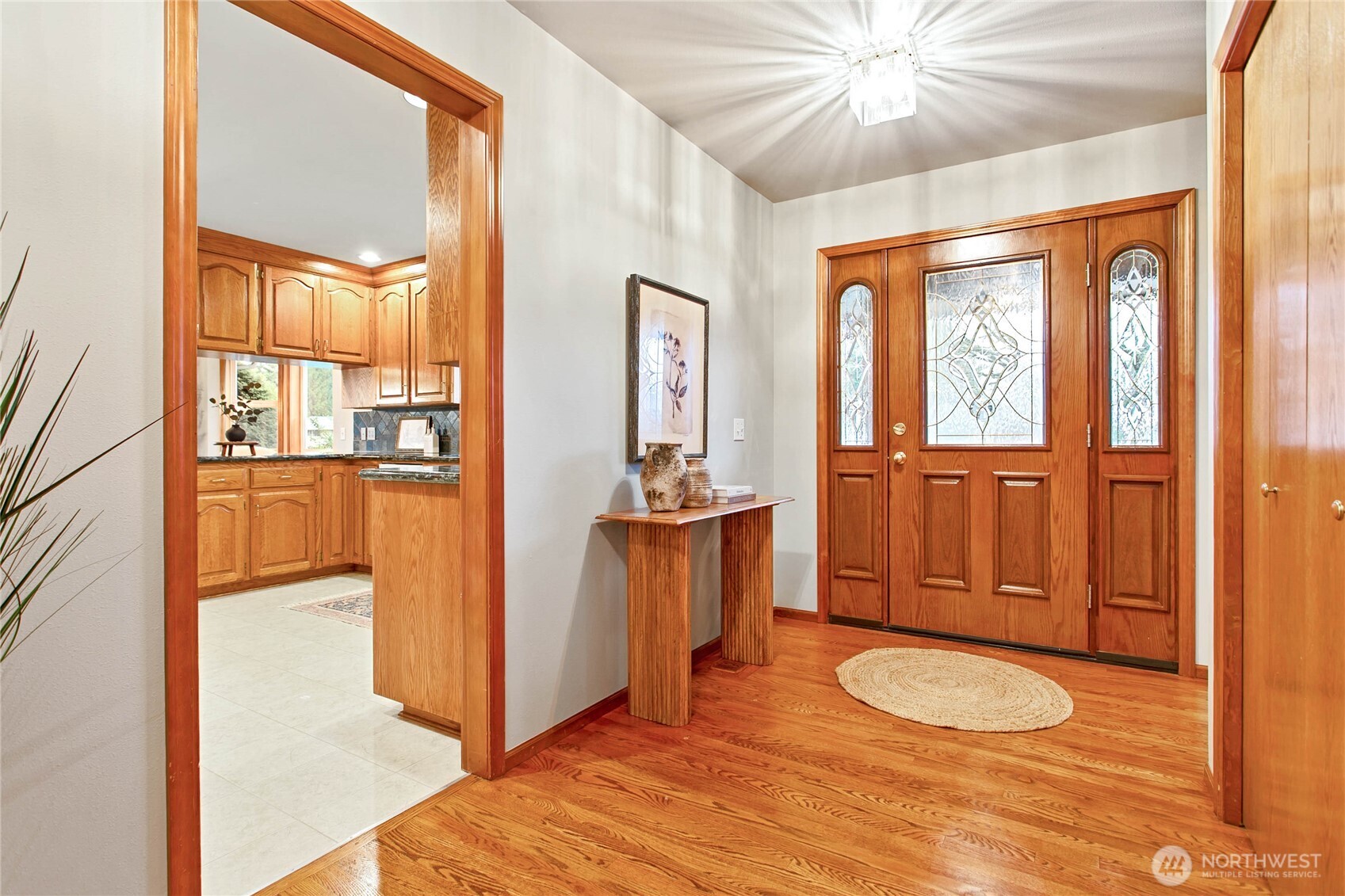 8639 Bender Road Lynden, WA 98264 - Photo 22 of 40 a view of a bedroom with wooden floor and windows