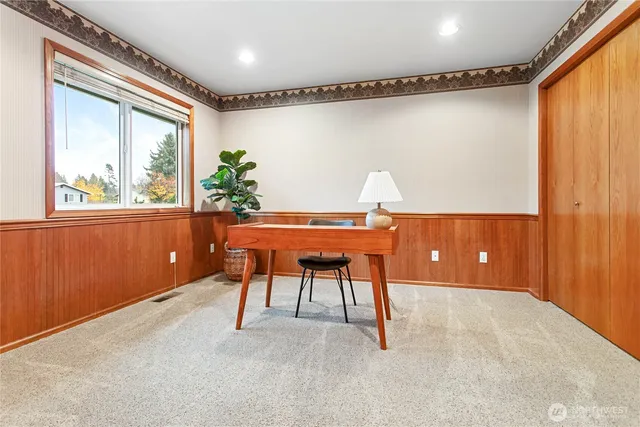 a workspace with furniture and window