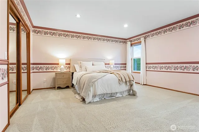 a bed room with a bed and a night stand