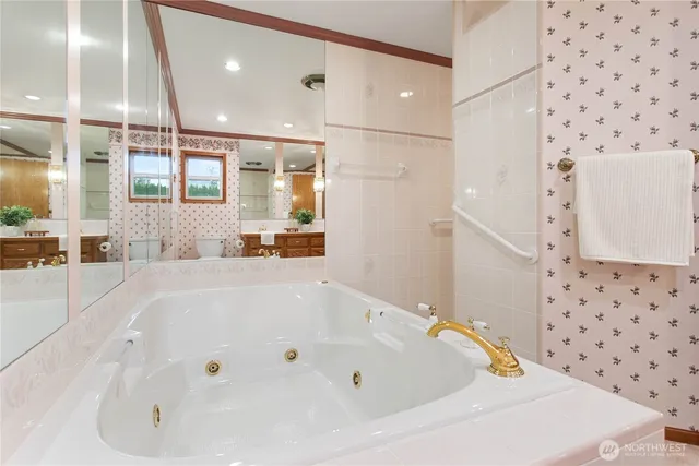 a bathroom with a bathtub and a shower