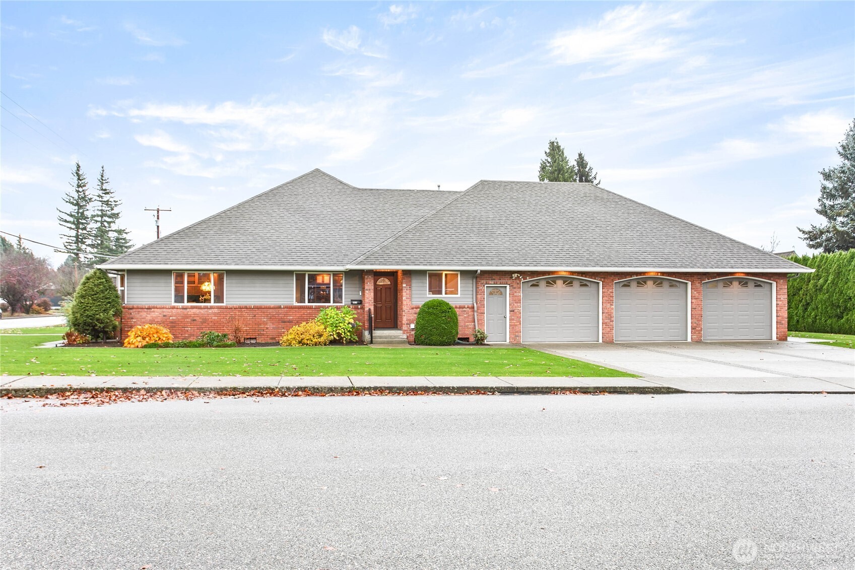 8639 Bender Road Lynden, WA 98264 - Photo 34 of 40 a front view of a house with a yard and garage