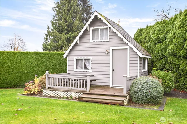 a view of a house with a yard and a garden
