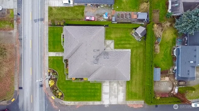 an aerial view of a house with outdoor space swimming pool