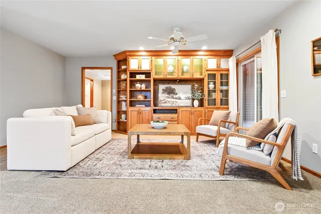 a living room with furniture and a large window
