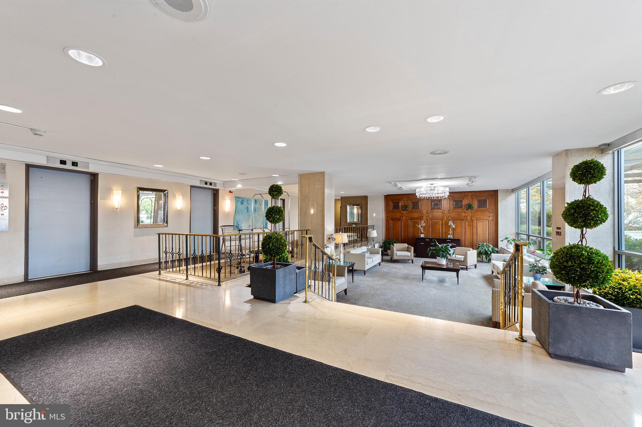 1900 Lyttonsville Road, Unit 111 Silver Spring, MD 20910 - Photo 21 of 21 a lobby with furniture and potted plants