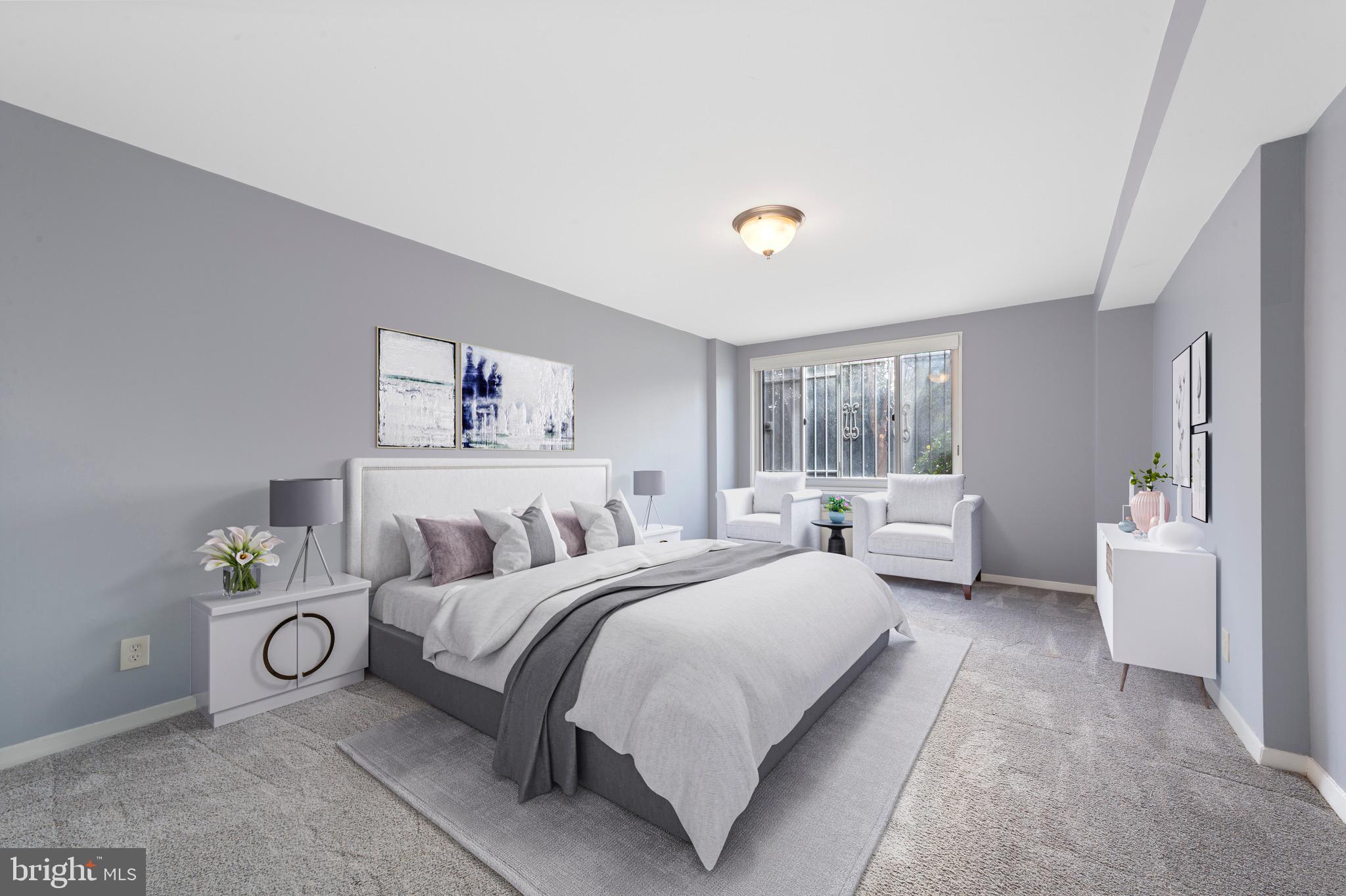 1900 Lyttonsville Road, Unit 111 Silver Spring, MD 20910 - Photo 6 of 21 a bedroom with a bed and a couch