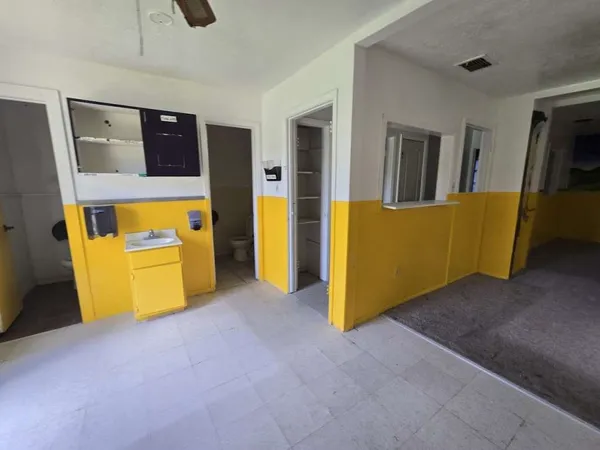 a view of an empty room with a sink