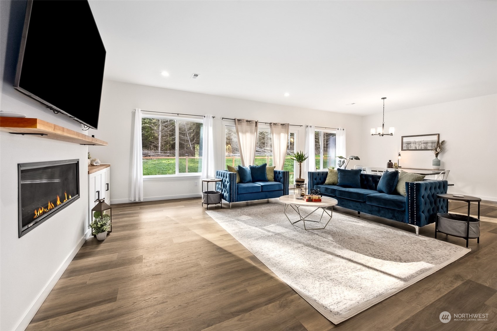 471 Southeast Ellis Road Shelton, WA 98584 - Photo 17 of 38 a living room with furniture and a flat screen tv