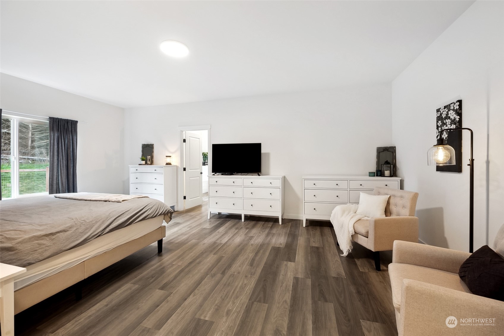 471 Southeast Ellis Road Shelton, WA 98584 - Photo 21 of 38 a bedroom with a bed and a flat screen tv