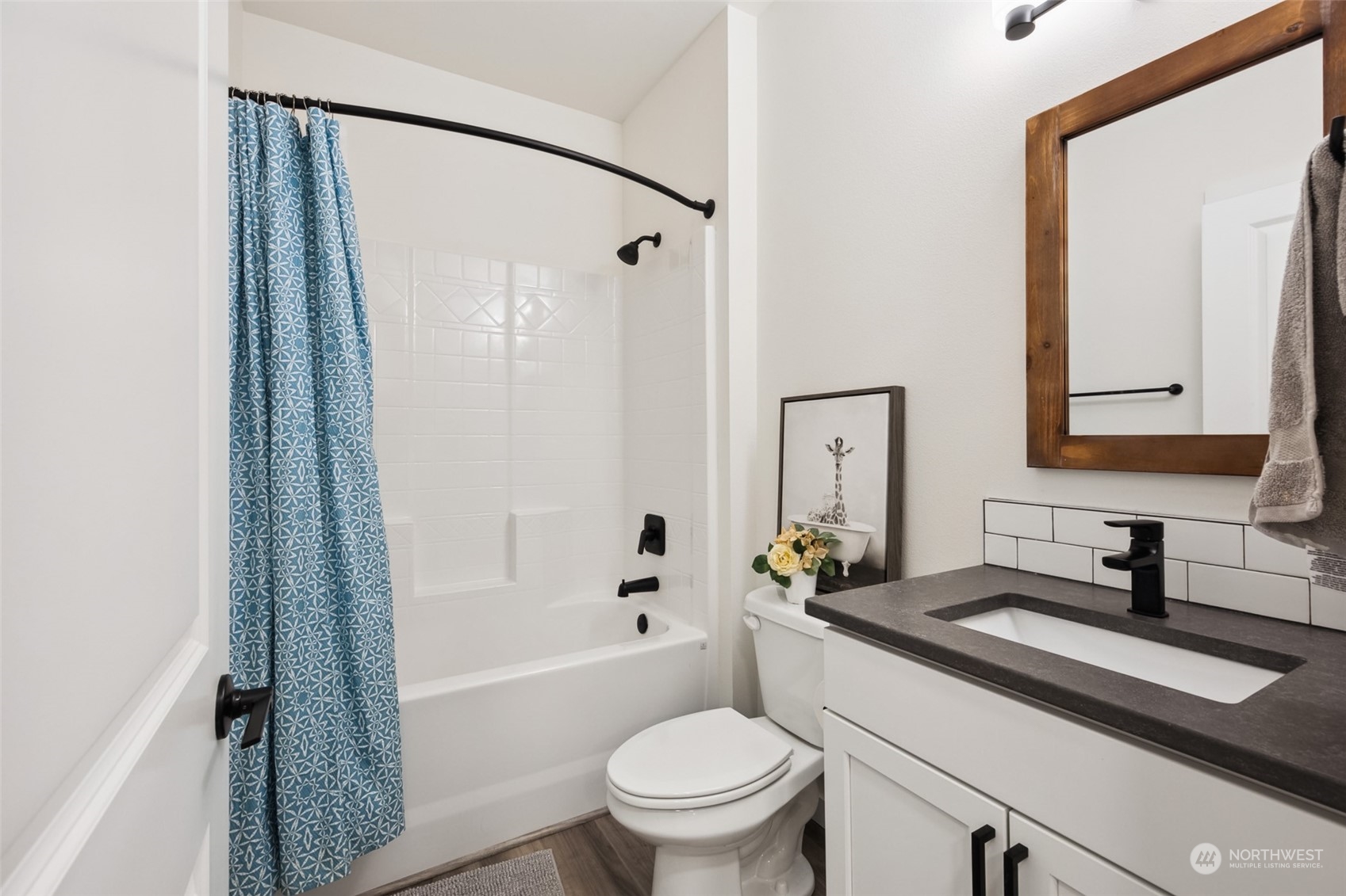 471 Southeast Ellis Road Shelton, WA 98584 - Photo 27 of 38 a bathroom with a granite countertop sink toilet a mirror and shower
