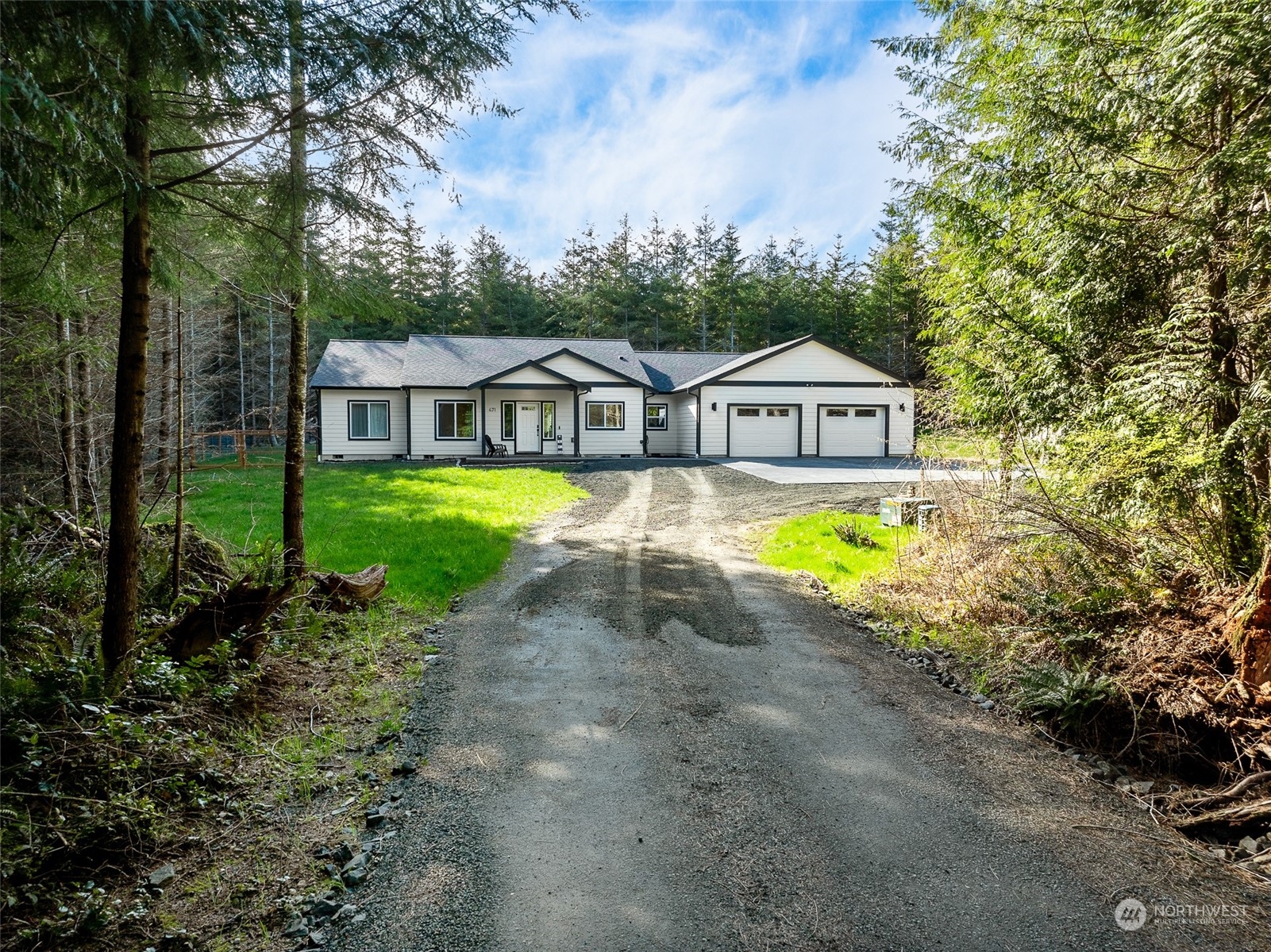 471 Southeast Ellis Road Shelton, WA 98584 - Photo 4 of 38 a view of a house with a big yard and large trees