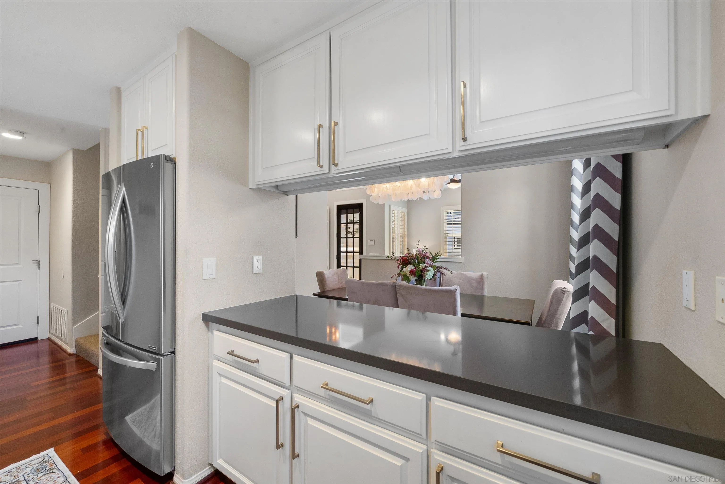 6755 Tyrian Street La Jolla, CA 92037 - Photo 15 of 60 a kitchen with stainless steel appliances granite countertop a refrigerator and a sink