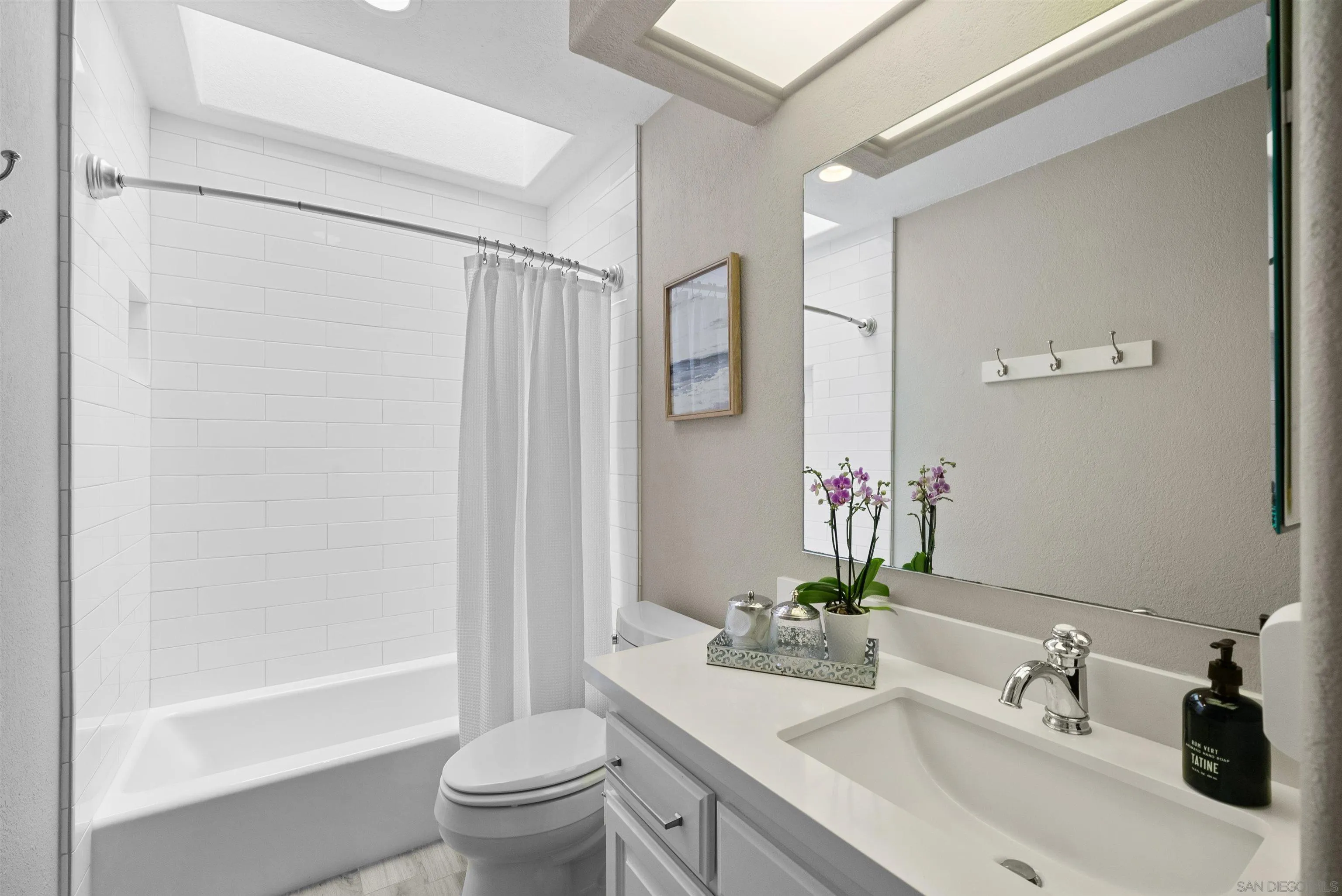 6755 Tyrian Street La Jolla, CA 92037 - Photo 21 of 60 a bathroom with a sink toilet and shower