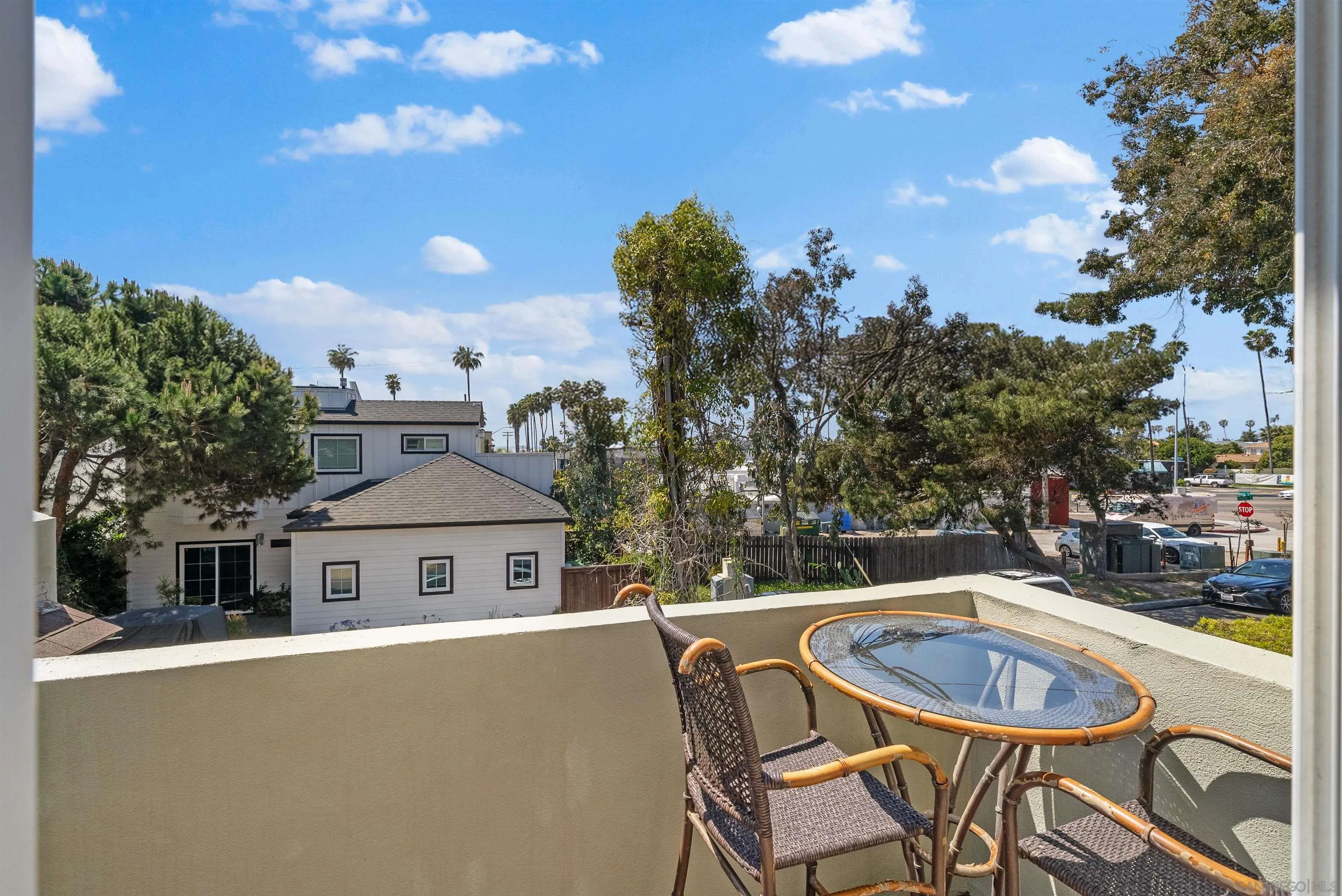 6755 Tyrian Street La Jolla, CA 92037 - Photo 25 of 60 a view of a balcony with table and chairs and a fire pit