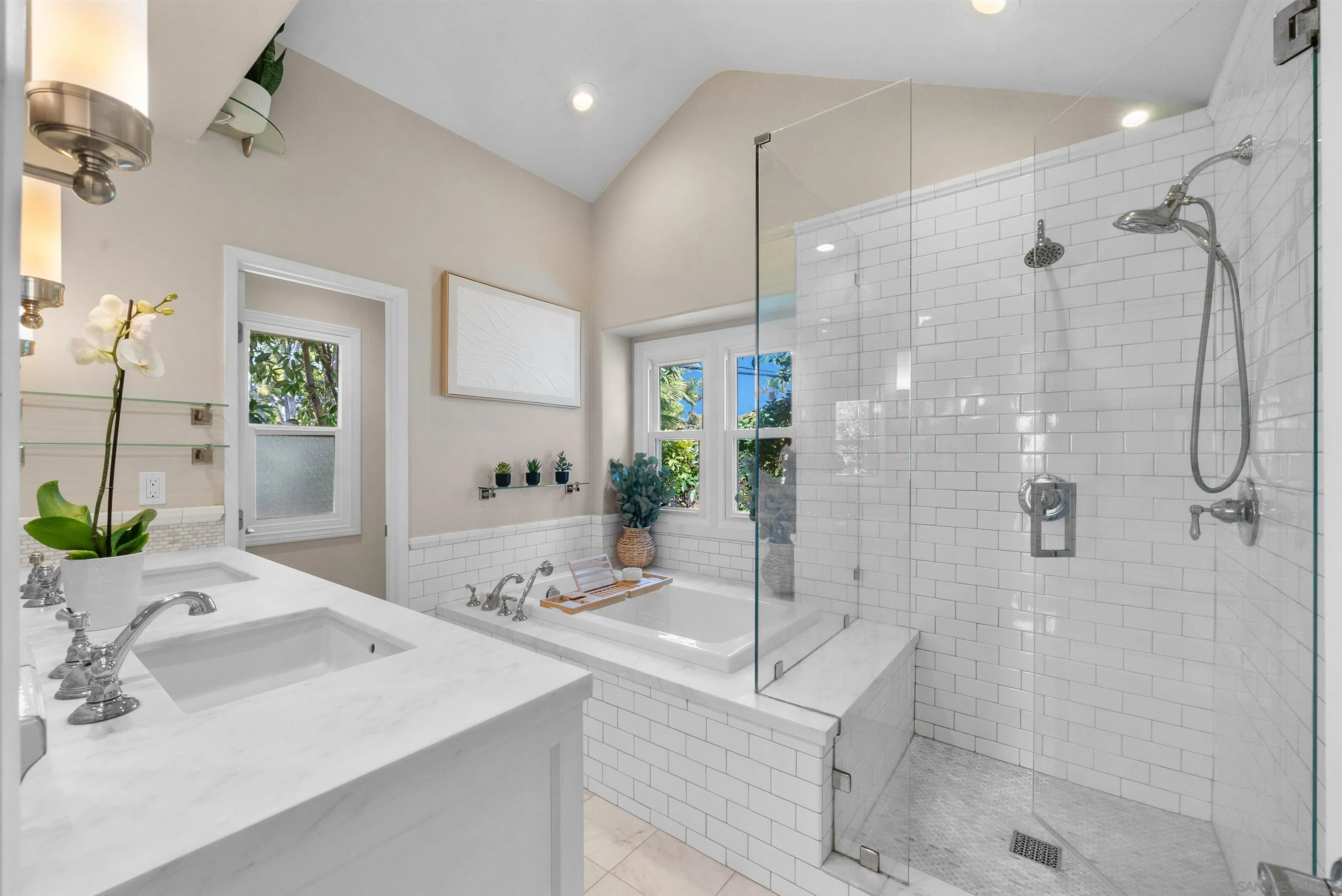 6755 Tyrian Street La Jolla, CA 92037 - Photo 27 of 60 a bathroom with a sink and shower