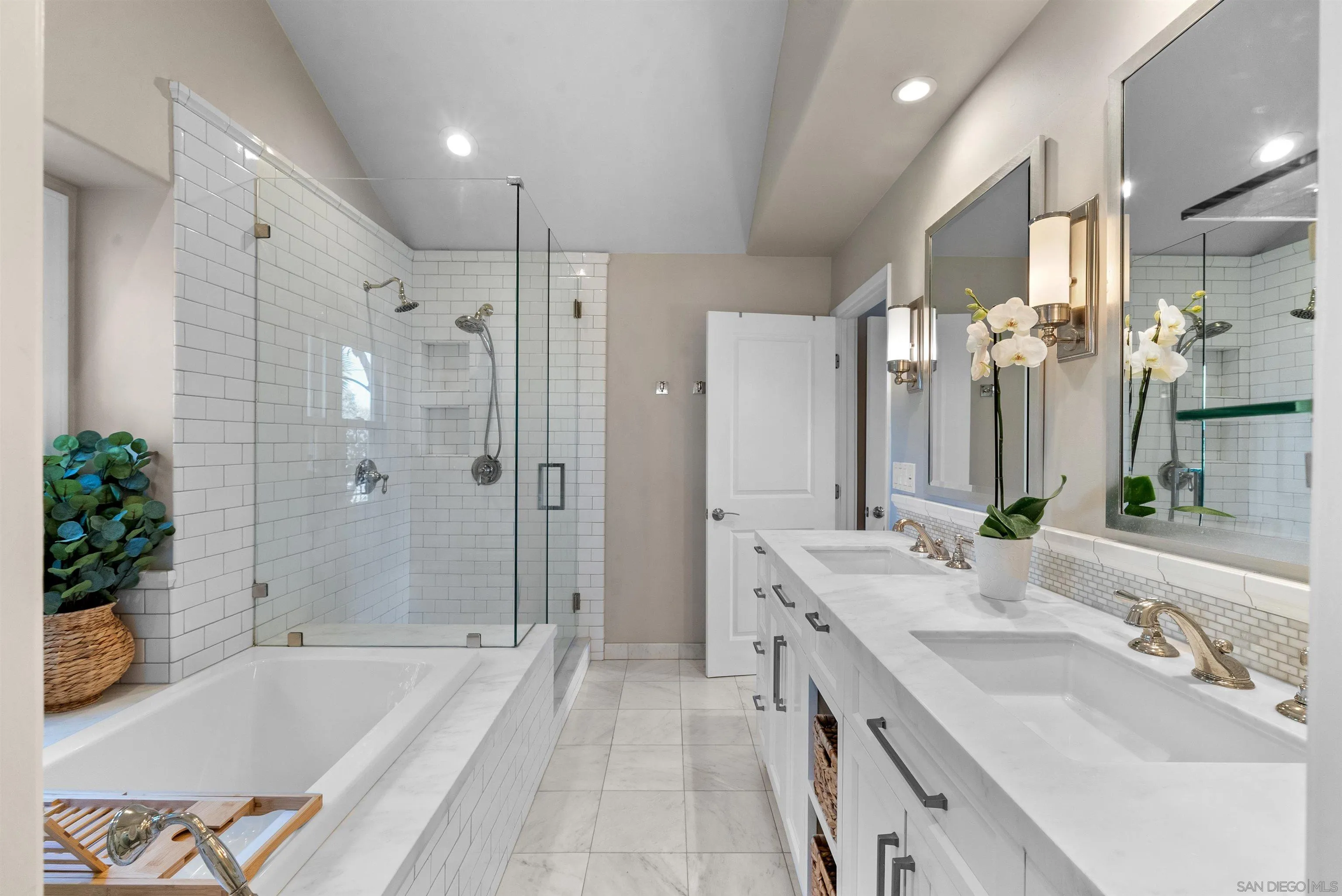 6755 Tyrian Street La Jolla, CA 92037 - Photo 29 of 60 a spacious bathroom with a granite countertop tub sink shower and mirror
