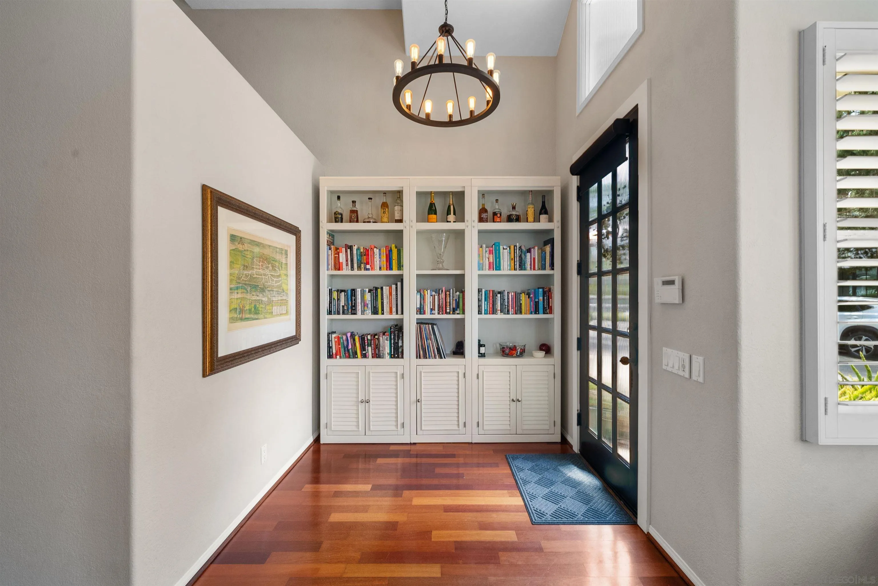 6755 Tyrian Street La Jolla, CA 92037 - Photo 3 of 60 a view of an entryway with wooden floor
