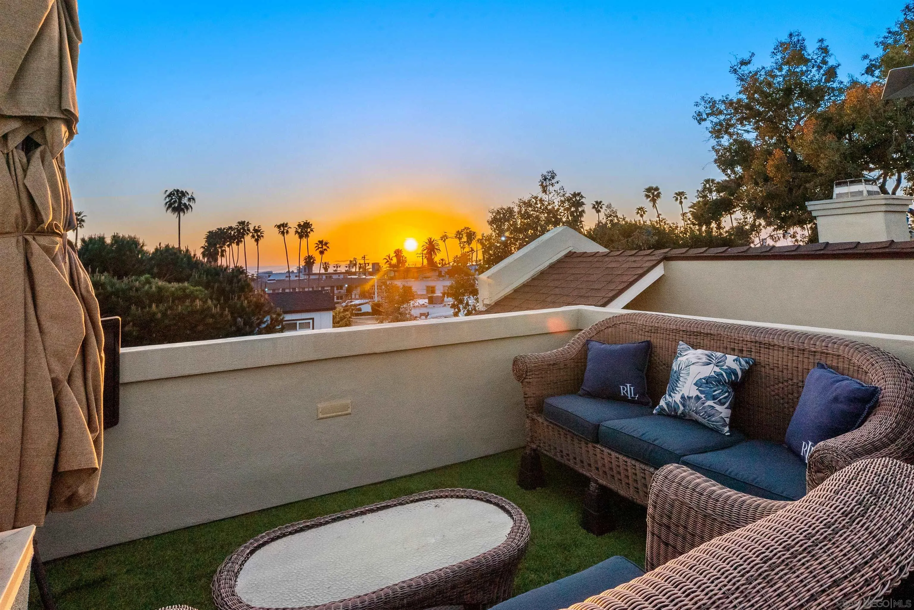 6755 Tyrian Street La Jolla, CA 92037 - Photo 37 of 60 a view of a balcony with two chairs and a potted plant