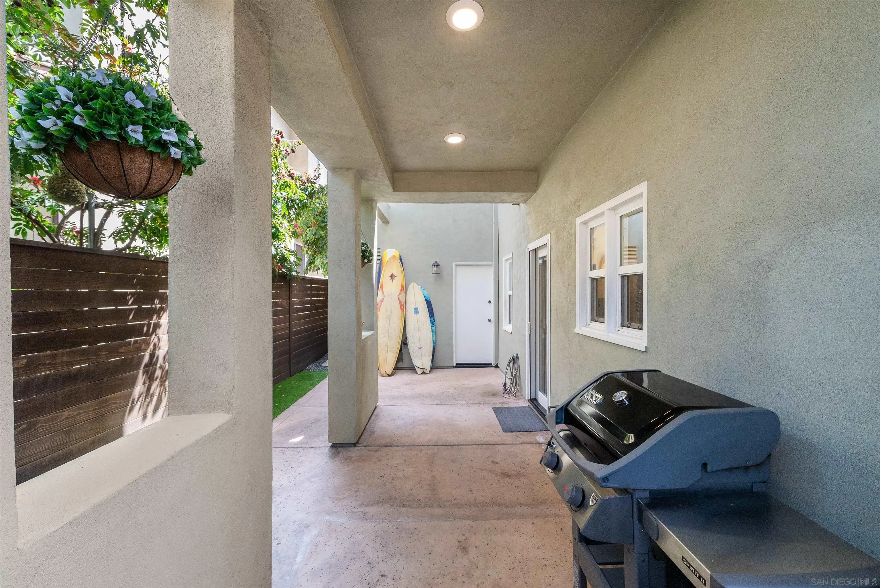 6755 Tyrian Street La Jolla, CA 92037 - Photo 53 of 60 a living room with furniture and a gate