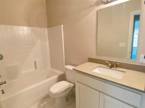 a bathroom with a sink a toilet and a bathtub