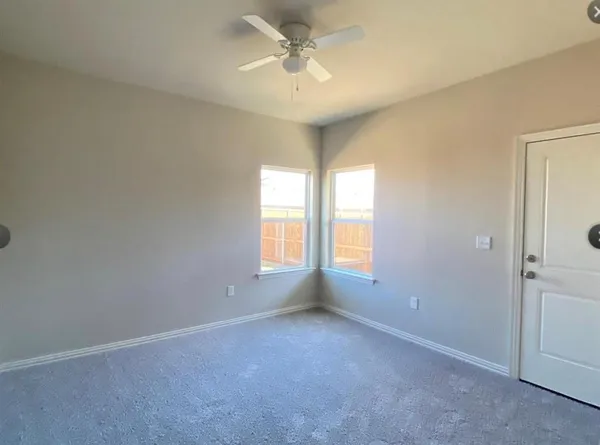 an empty room with a empty space and a window