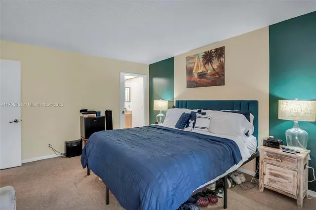 a bedroom with a bed and a view of bedroom