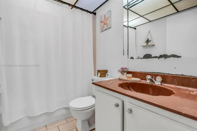 a bathroom with a sink and toilet