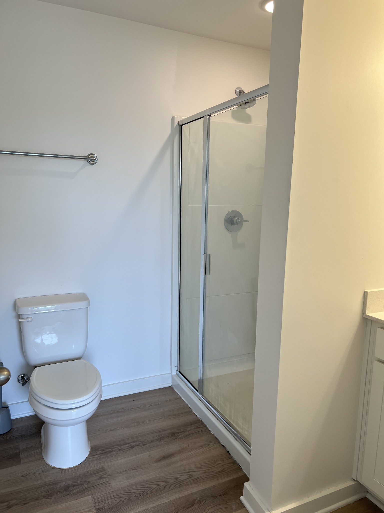 302 Williams Avenue, Unit 110 Madison, TN 37115 - Photo 10 of 11 a white toilet sitting next to a bathroom sink