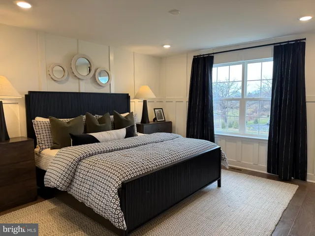 a bedroom with bed and window