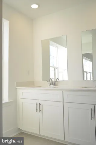 a bathroom with a sink and vanity