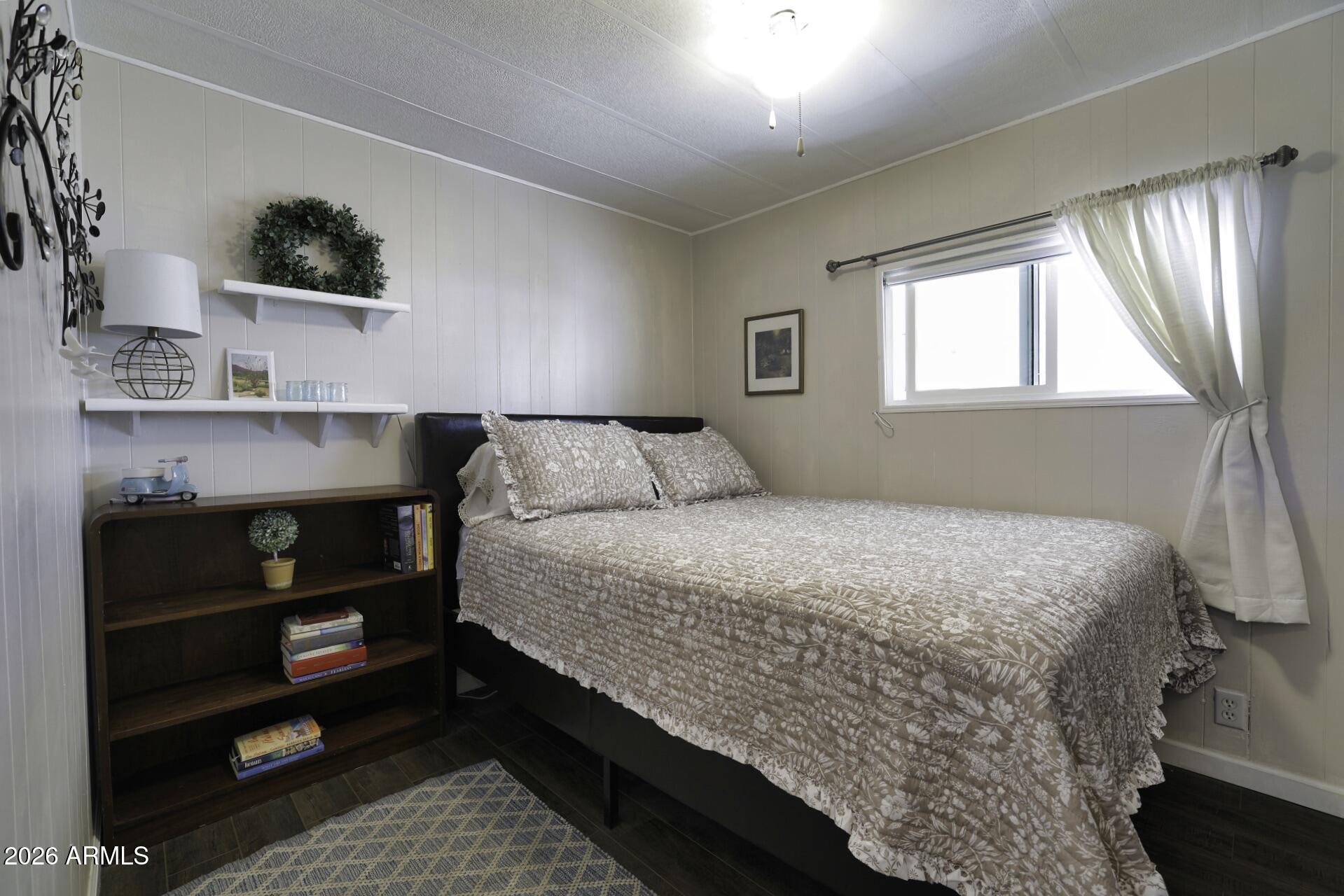 8600 East Broadway Road, Unit 13 Mesa, AZ 85208 - Photo 11 of 16 a bedroom with a bed and a window