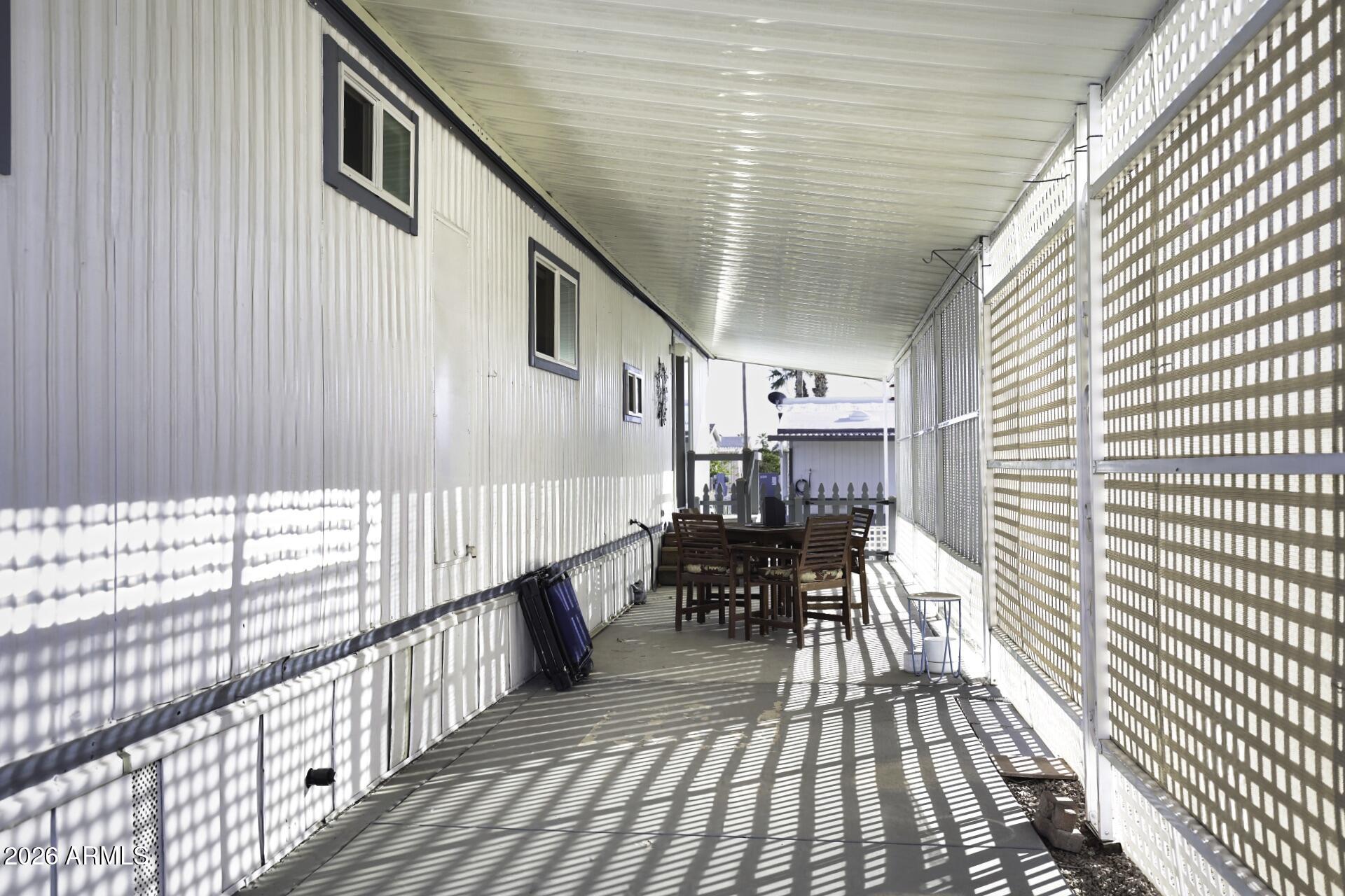 8600 East Broadway Road, Unit 13 Mesa, AZ 85208 - Photo 15 of 16 a balcony view with two chairs and a table