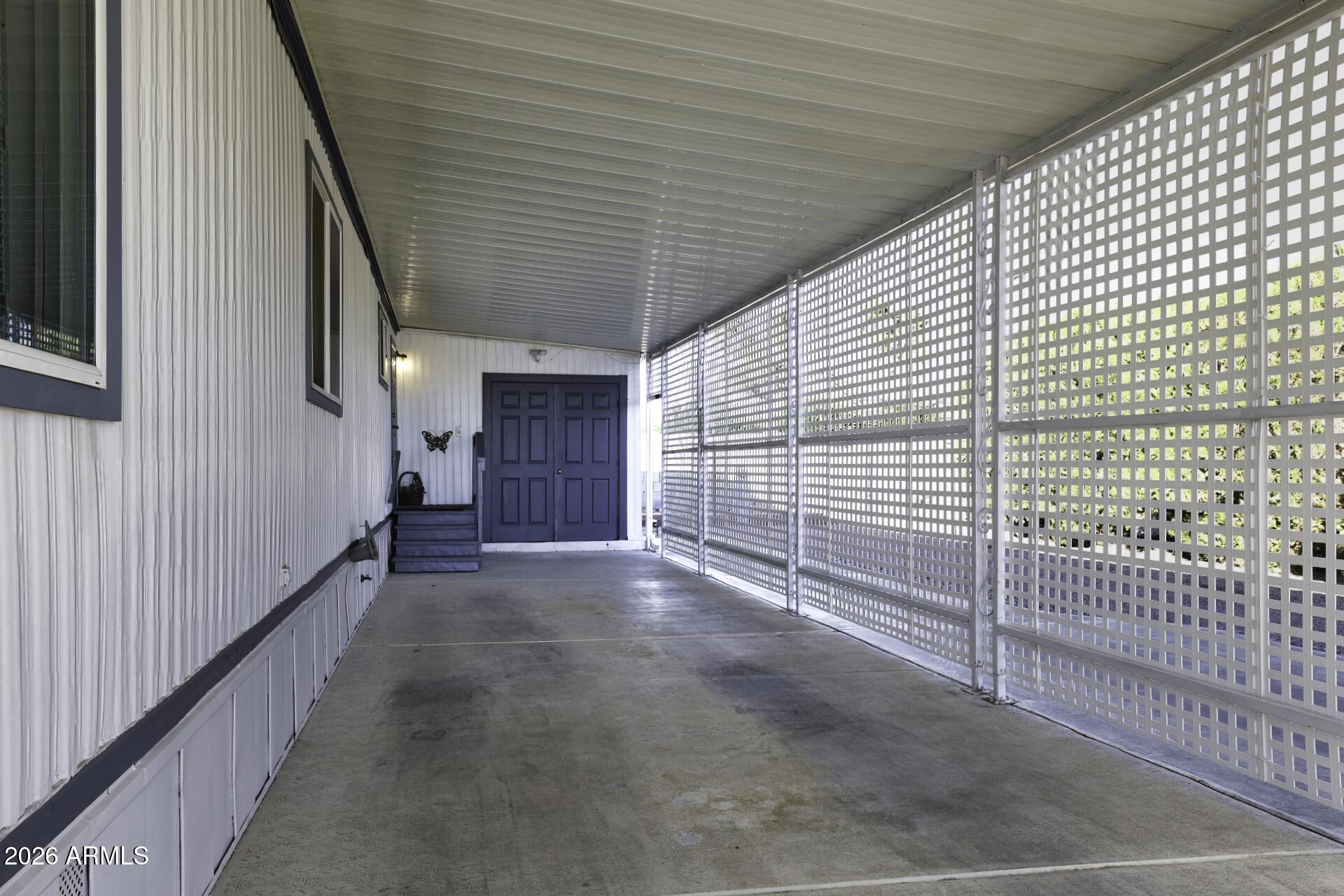 8600 East Broadway Road, Unit 13 Mesa, AZ 85208 - Photo 2 of 16 a view of a house with wooden fence